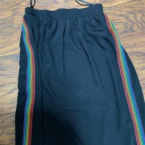 Long black maxi skirt and sweatshirt- colorful stripes on the side
